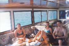 Nikki, Delphine, and Ian inside the boat